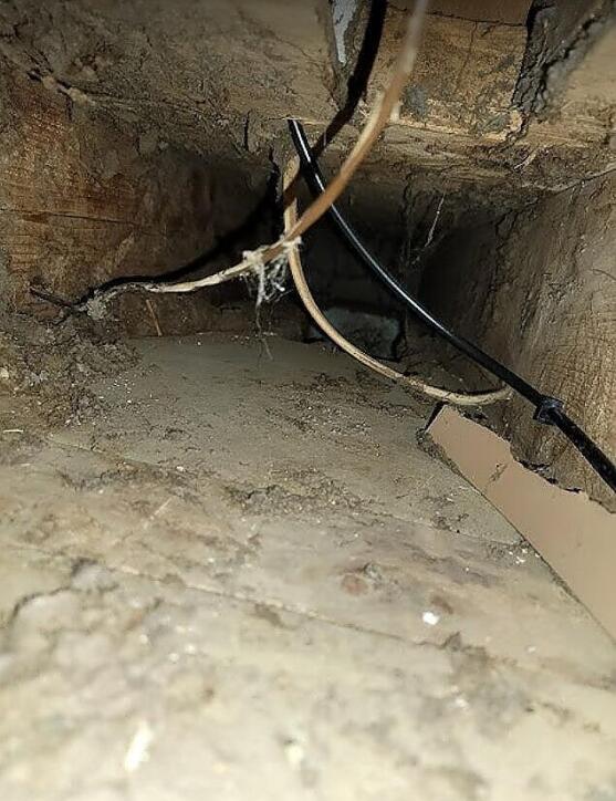 Picture 1: a dirty air duct before it was cleaned by Scrubber Ducts. Showing what happens when air ducts aren't cleaned.
